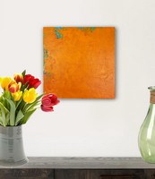 modern art painting on a table with flowers